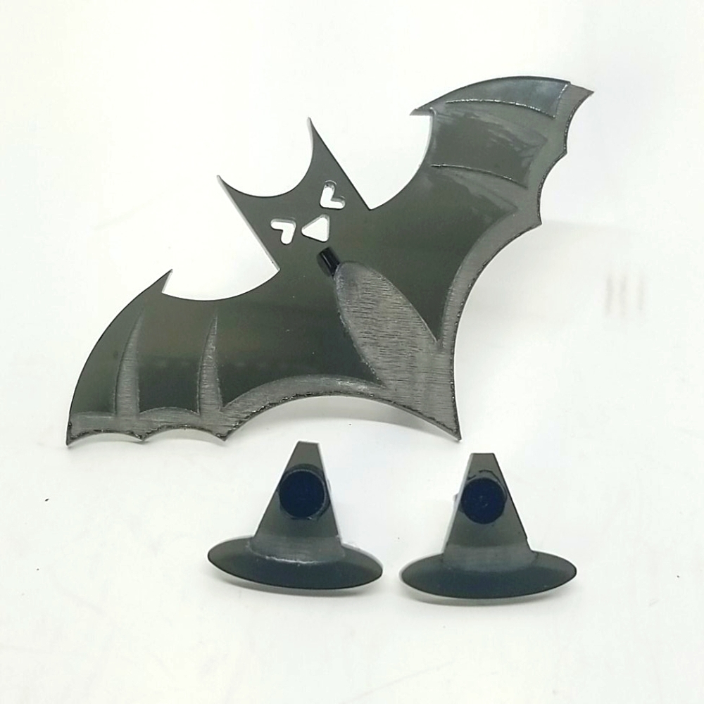Halloween earings and lapel pin.